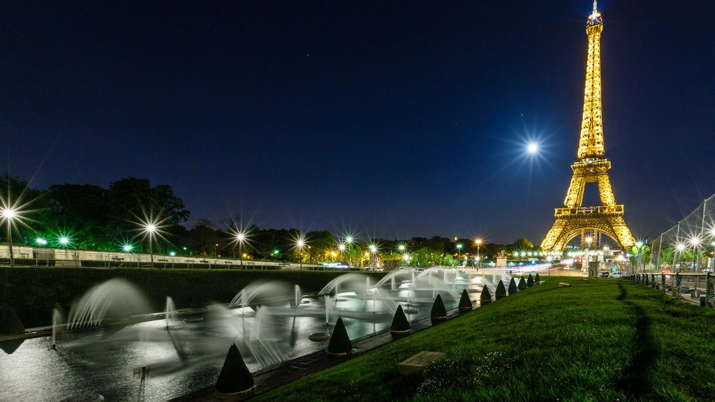 Image of the Eiffel Tower and Trocadero fountain at night in Paris, France representing the Myths and Facts about COP21, the Paris Climate Agreement post for Climate Nexus
