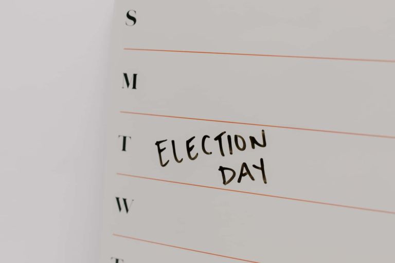 Image of a calendar that reads "election day", U.S. voters support climate action | Climate Nexus Polls