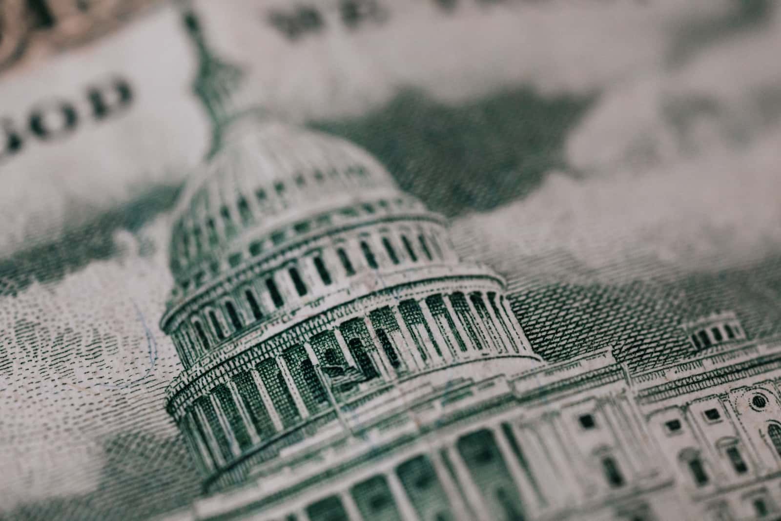 Photo of Congress on a US dollar bill representing stimulus bill to support climate change | Climate Nexus Polls