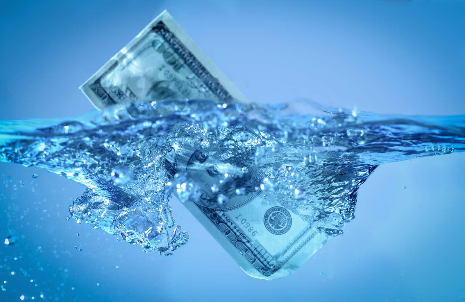 Image of a $100 bill submerged in water to express support of stimulus funding for water programs | Climate Nexus Polls