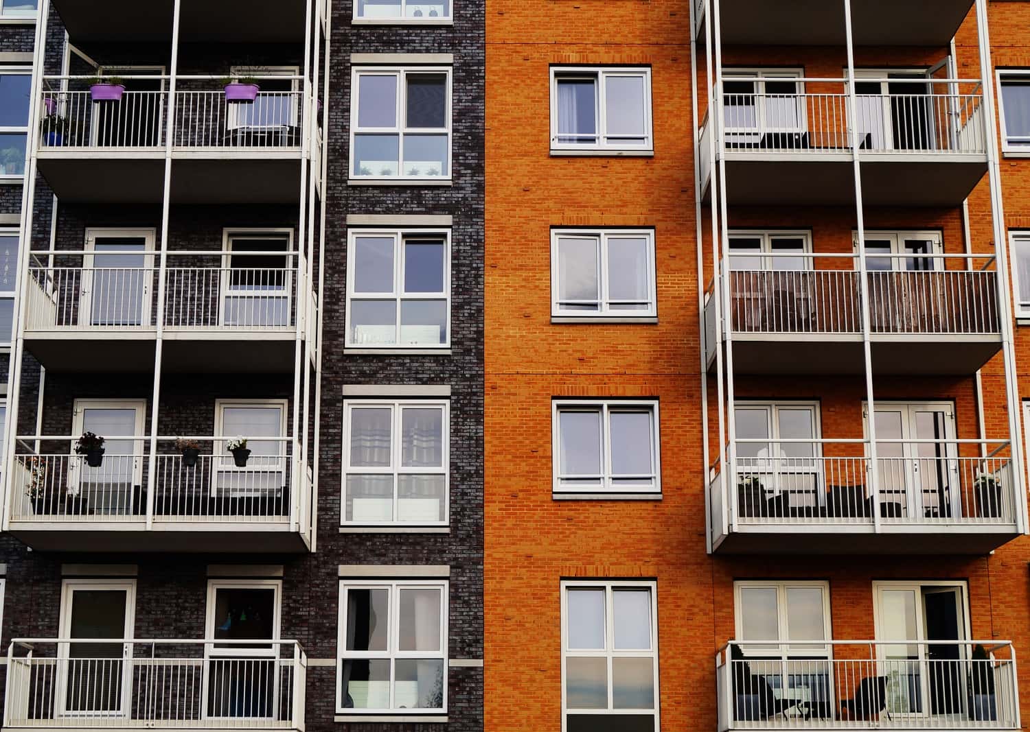 image of the front of a building with balconies | COMMUNICATIONS ASSOCIATE ELECTRIFICATION TEAM CLIMATE NEXUS