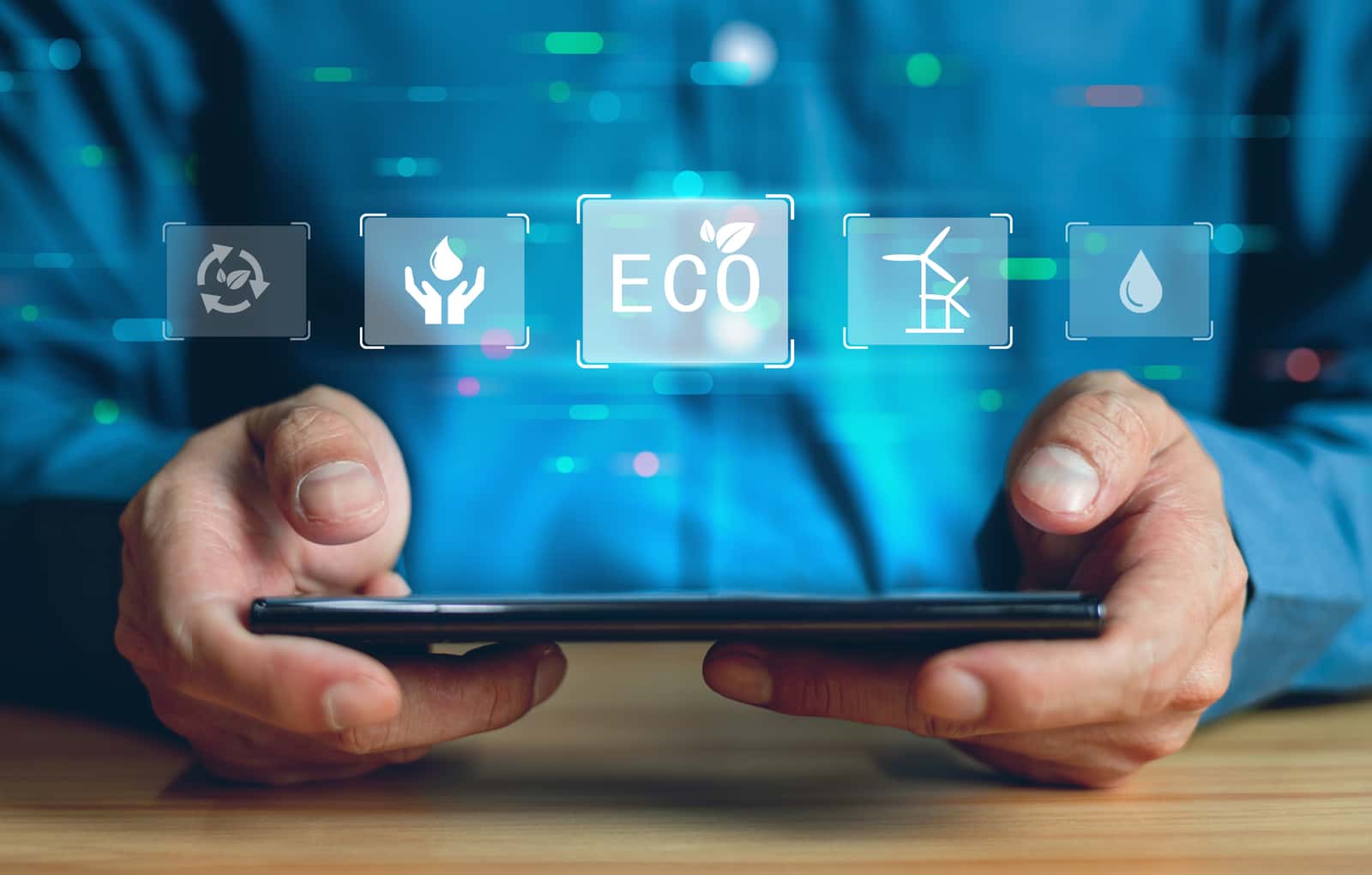 Hands holding a tablet device with climate changes symbols coming out of the tablet, representing the Director, Clean Transportation Communications job post for Climate Nexus