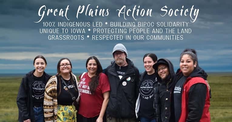 Great Plains Action Society members standing outside with text that reads "100% Indigenous led, Protecting People and the Land Grassroots, Respected in our Communities."